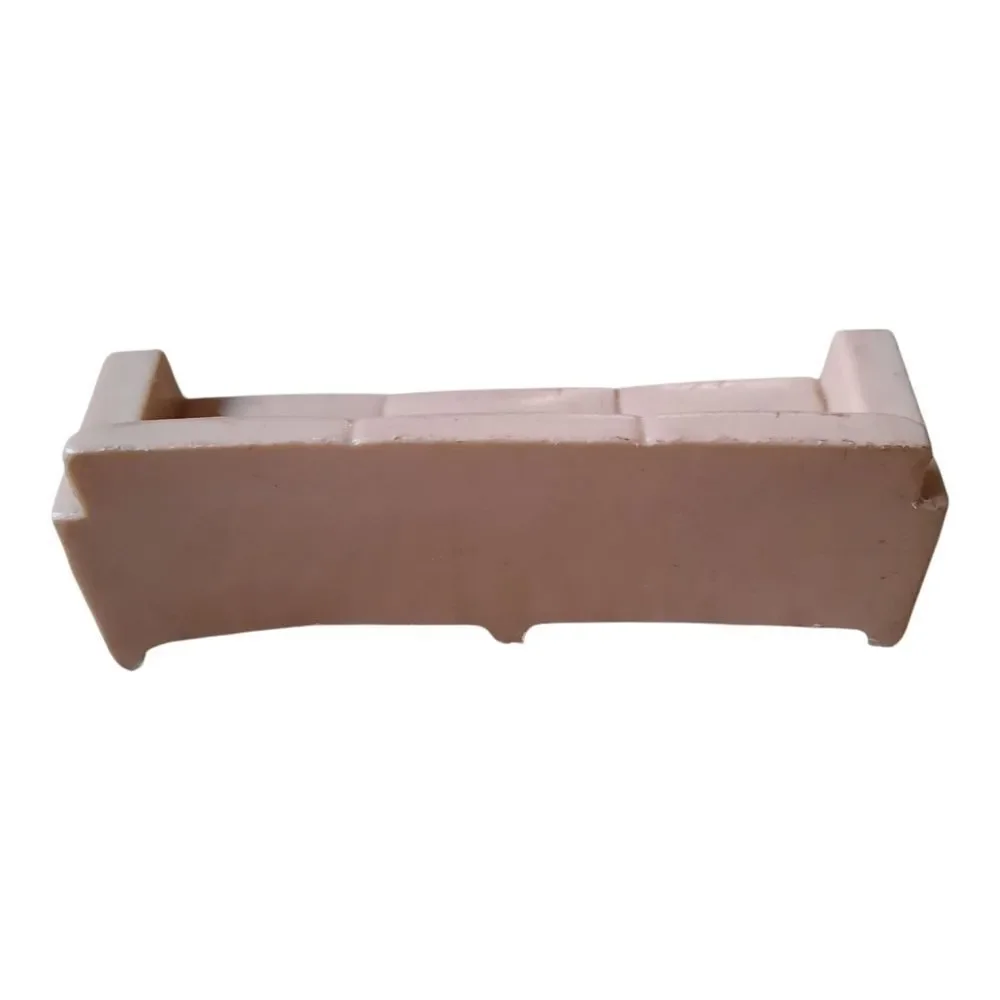 Marx hard plastic dollhouse sofa in a pale pink color.